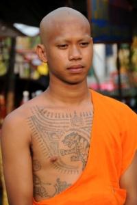 Young monk with tattoos