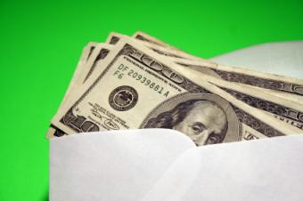 Hundred Dollar Bills in White Envelope