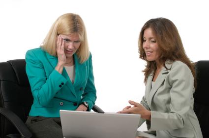 Two women looking at computer
