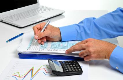 Businessman reviewing tax docs