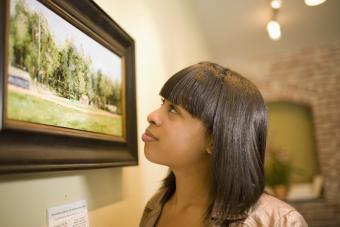 admiring painting in gallery