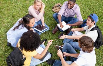 friends sitting on grass