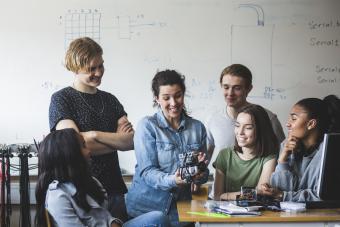 Teens working with a robotics project