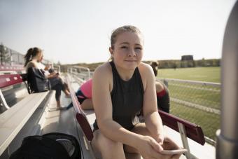 Teen girl on bleachers