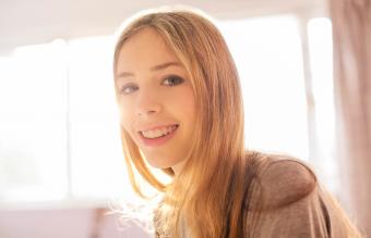 Portrait smiling blonde teenage girl