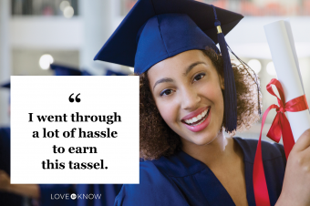 Graduate in cap and gown holding diploma