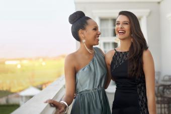 Two best friends posing outside for prom pictures