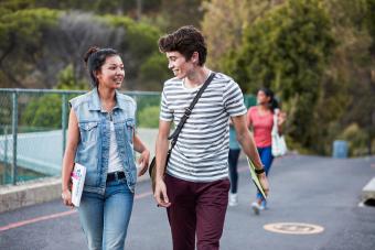 Friends walking to school together & laughing