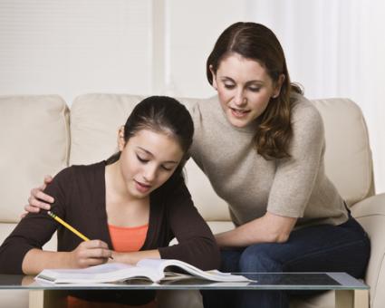 Woman helping daughter with homework; © Jonathan Ross | Dreamstime.com