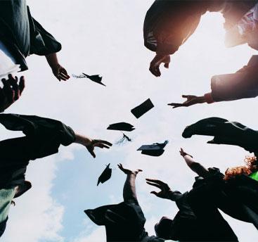 Throwing graduation hats in the air