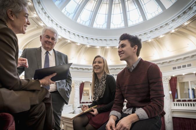 teenagers talking to politicians