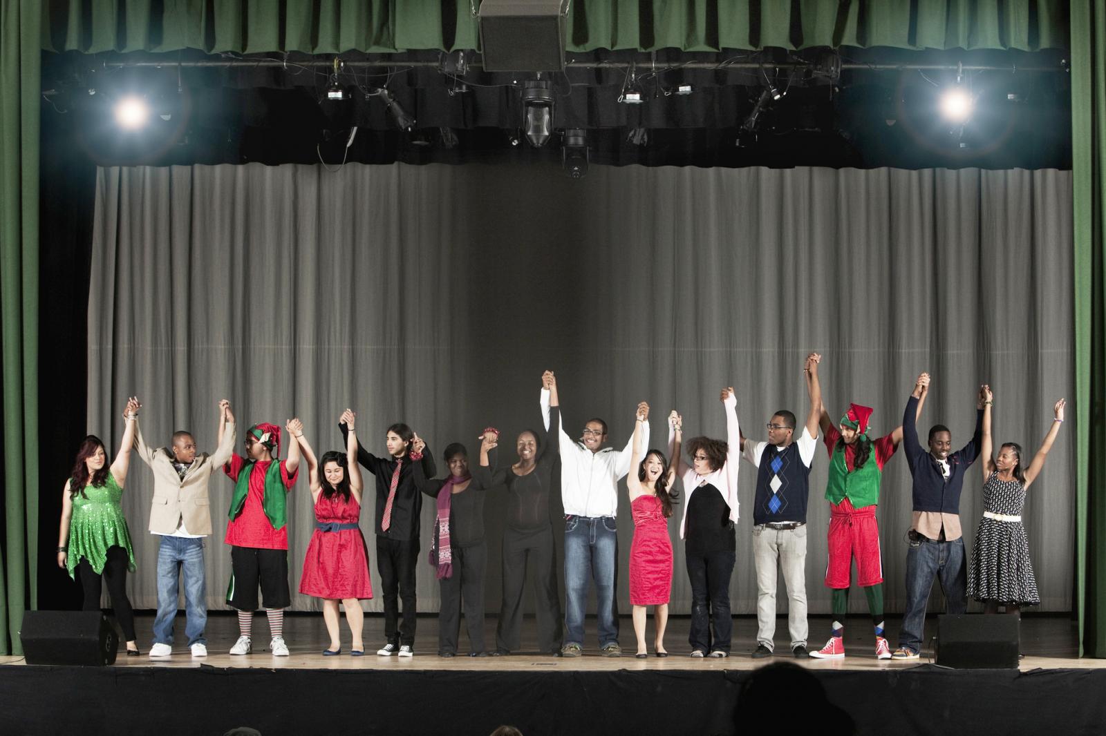 Students bowing on high school stage