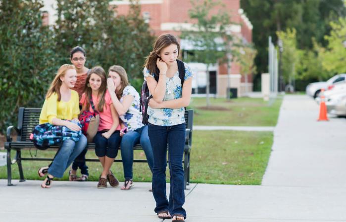 Girl being teased by other girls