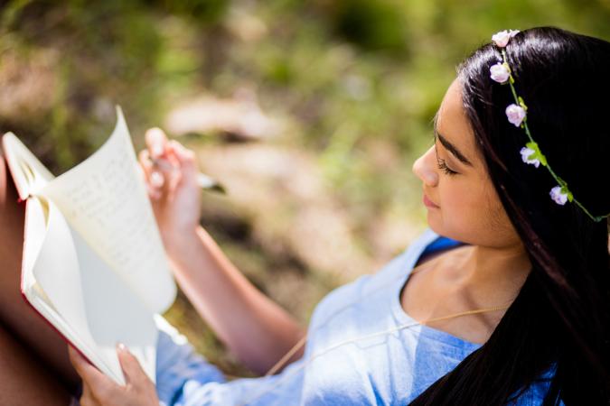 girl writing in her journal