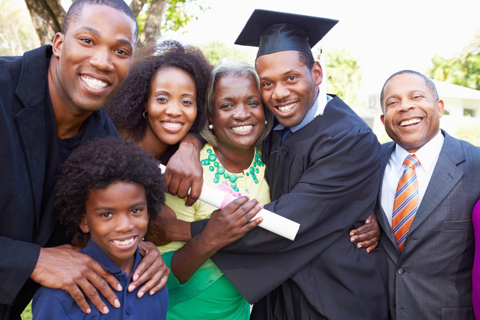 Student celebrating his graduation with his family