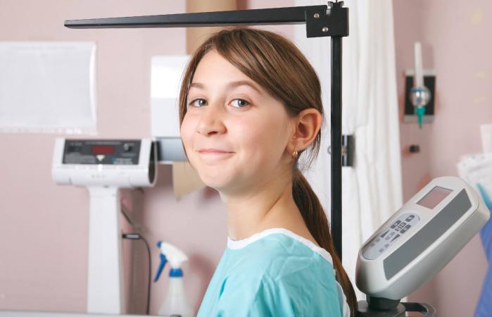 Teen girl measuring height