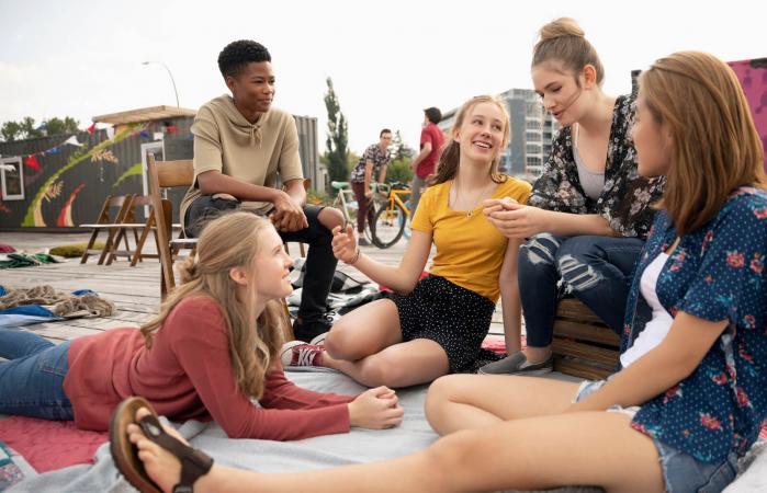 Teenagers hanging out in urban park