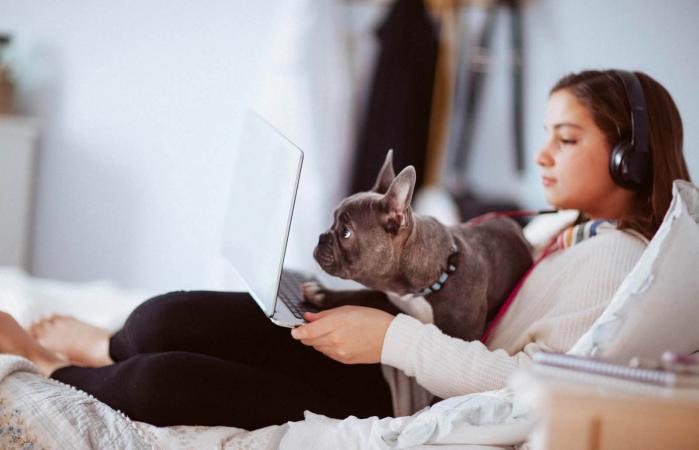 girl with headphones using computer