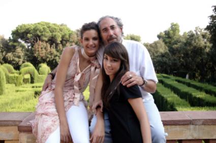 A father and his two daughters.