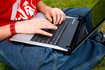 Child's hands on laptop