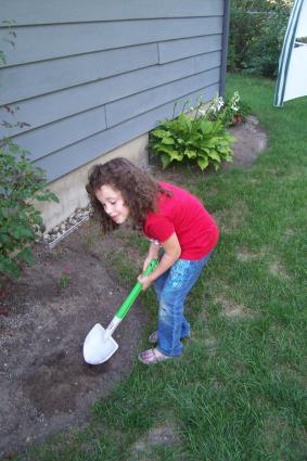 Child gardening with Little Tikes Shovel