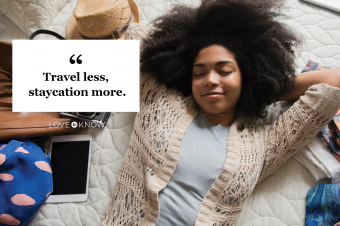 Woman laying on bed anticipating travel
