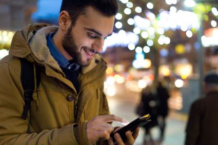 Man using phone to hail Uber