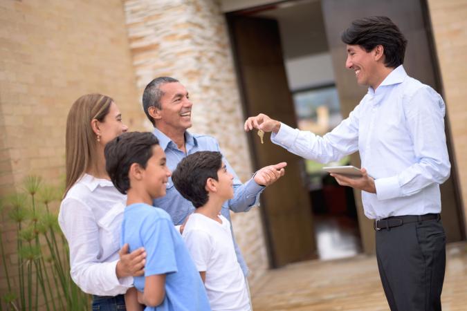Handing house keys to renters