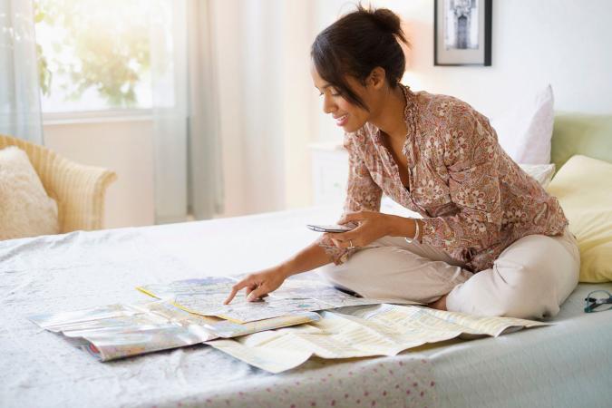 Woman looking at map planning trip