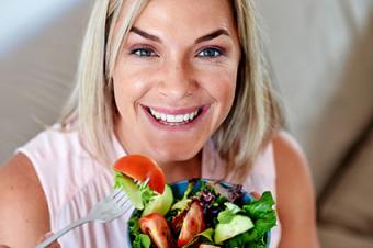 Woman eating salad