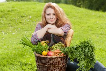Woman with basket of fresh vegetables