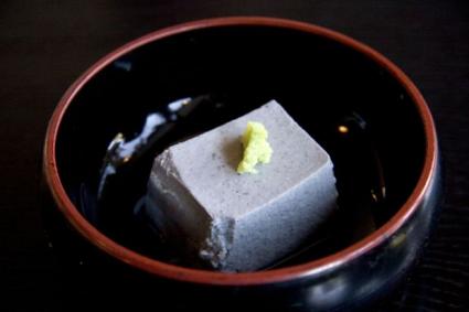 Block of tofu in a bowl.