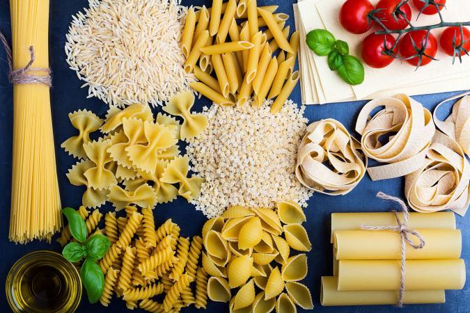 variety of pastas on blue background