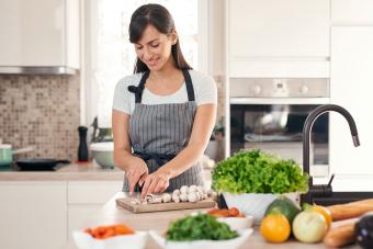 woman chopping mushrooms for a potassium rich salad