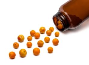 Medicine Bottle Spilling Out Oranges