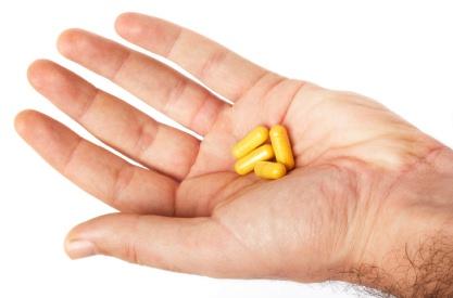 hand holding vitamins