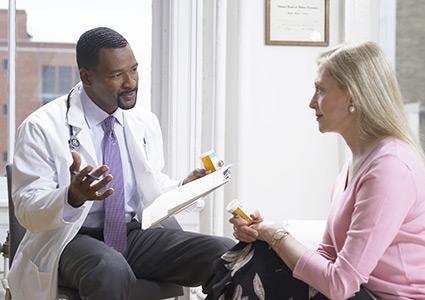 Doctor conferring with patient