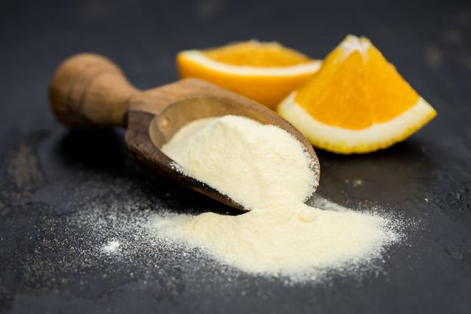 Vitamin C crystals and orange slices