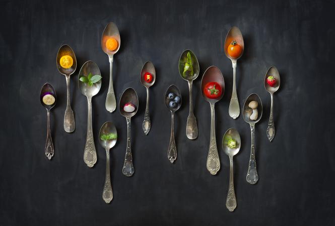 Colorful foods in antique spoons