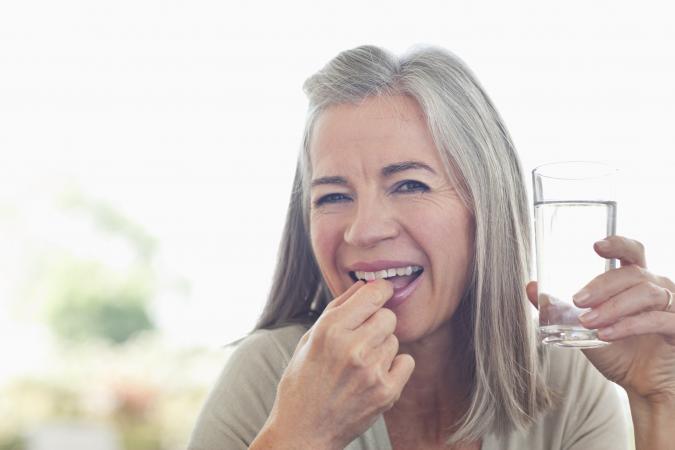 Woman taking a pill