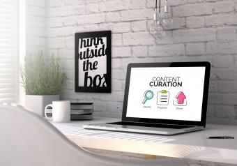 Laptop with content curation concept onscreen