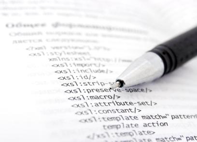 page of XML with a pen