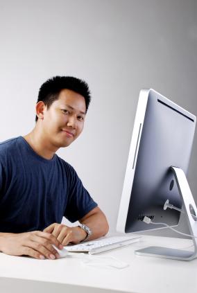 A web designer happy at his computer