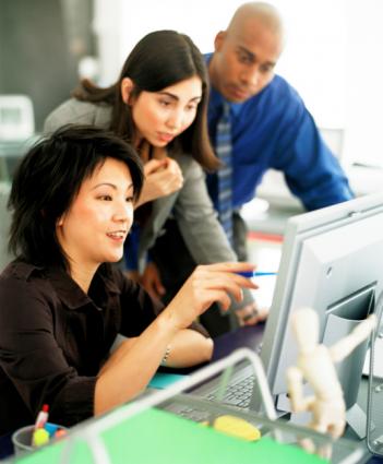 People discussing the layout on the computer screen