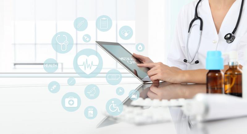 doctor accessing medical website on tablet