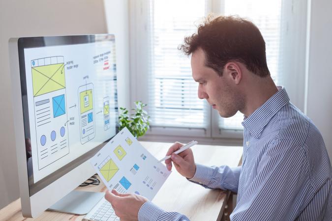 Website designer at computer