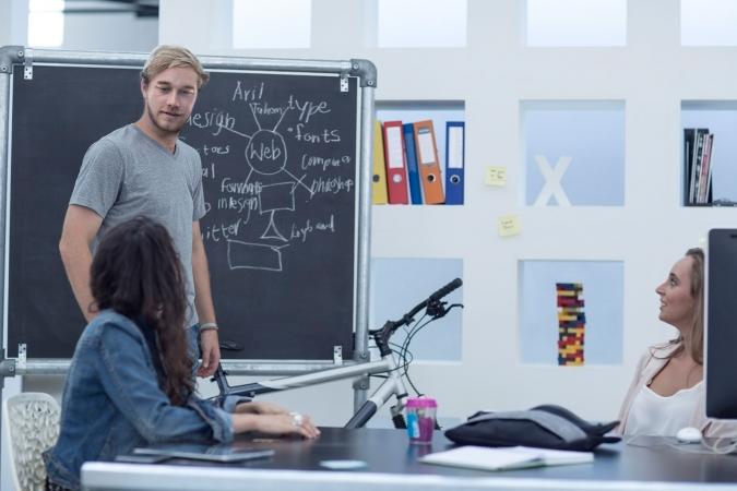 Website designers discussing web design