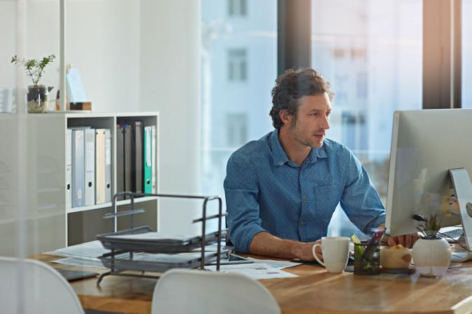 Man working on computer in office