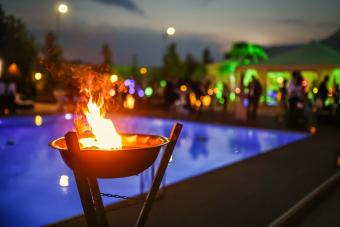 Flaming torch by evening luau pool