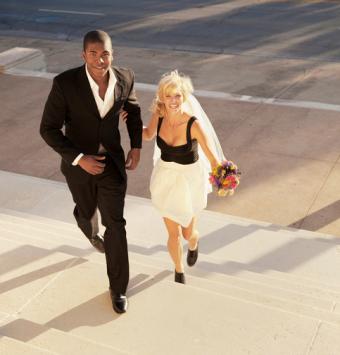 Bride and groom walking up stairs